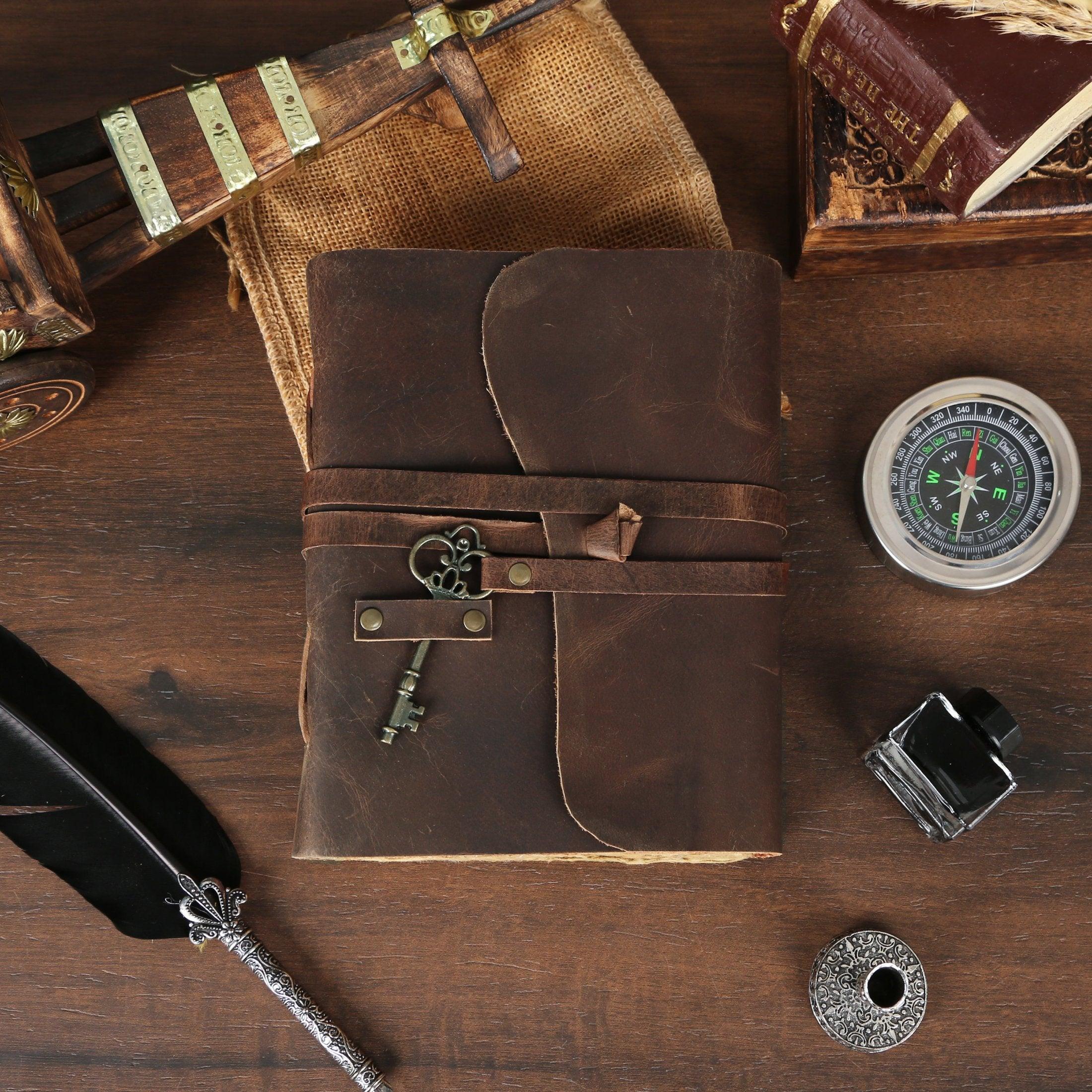 Vintage leather journal on desk with accessories, a unique gift for artists and travelers